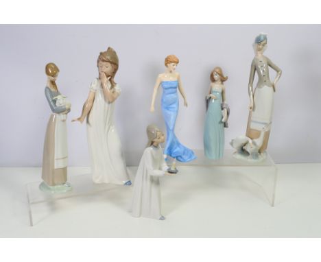 A collection of Lladro and Nao figures, also included in the lot is a Royal Doulton Princess Diana figure, largest approximat