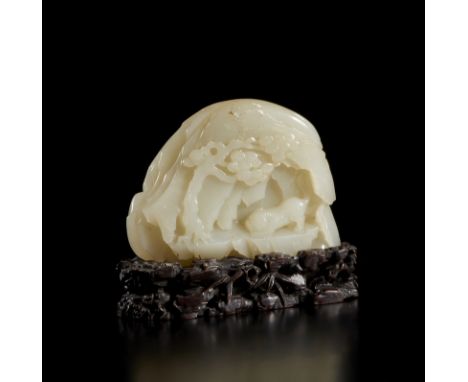 A fine white jade carving depicting a heremit in a caveChina, Republic period, first half of 20th century Cm 12,00 x 10,00
