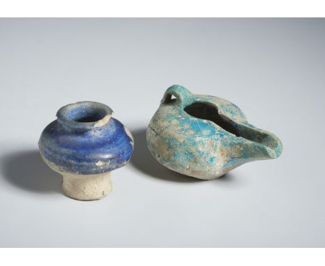 A blue glazed small vase and a turquoise glazed oil lamp Persia, 12th century Restored. Other dimensions:5.2 x 7 cm Cm 6,00 x