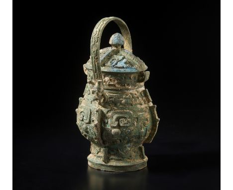 An archaic style You ritual vessel China, 20th century Ritual container with lid in the Shang style, characterised by decorat