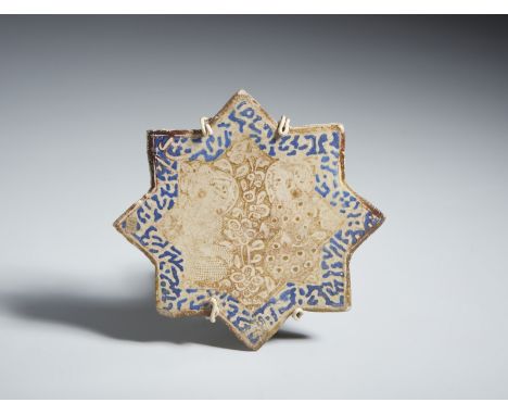 A star shaped lustre painted tile Iran, Kashan, 13th-14th century Frit body, with a characteristic star shape given by the in