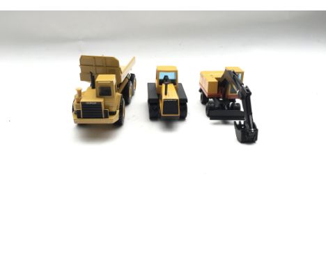 Collection of die-cast model Vehicles. Boxed.Mighty Movers Dump Truck. 1:50 Scale.Joal Cat Tractor 65. 1:50 Scale.Joal Excava