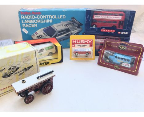 A Box Containing a Radio Controlled Lamborghini. 2 x Corgi London Busses. A Corgi Escort Van #497. A Matchbox Showman's Engin