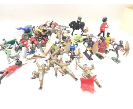 A collection of vintage Britain's and other figures.