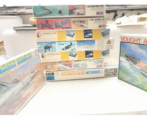 A box containing various Aircraft model kits including Monogram,