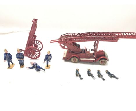 A Taylor and Barrett Fire Engine and Ladder with men.