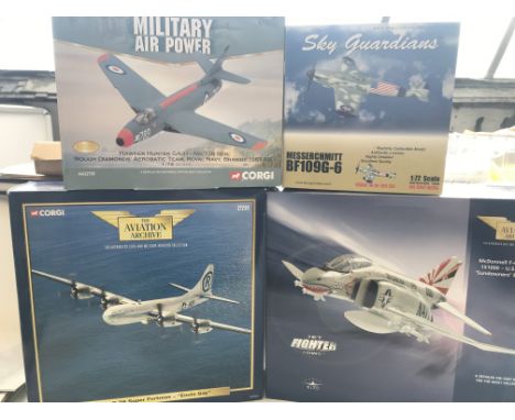 4 model Aircraft including a corgi Boeing B-29. A Corgi Phantom II. A Hawker Hunter and a Sky Guardians Messerschmitt. All bo