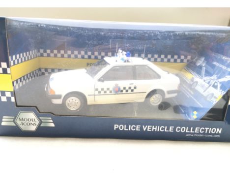 A Boxed Model Icons Ford Escort 1.1l. section Car Essex Police #999005.Scale 1/18.