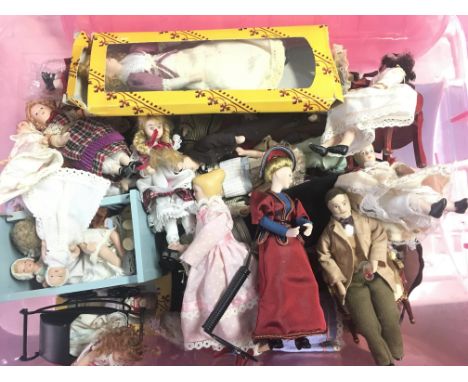 A Box Containing a Collection of Vintage Dolls and accessories.