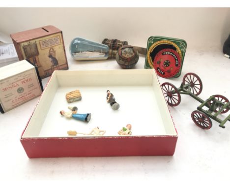A Box containing a Collection of Vintage Money Boxes. A ship in a light bulb and others.