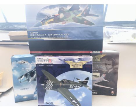 4 x Boxed Corgi Aircraft including a Thunderbolt, a Mig 29, a Harrier and a Douglas DC3. Scale 1:72