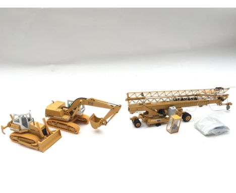 Collection of Liebherr model Vehicles. Boxed.Crawler tractor.Hydraulic ExcavatorCrane.