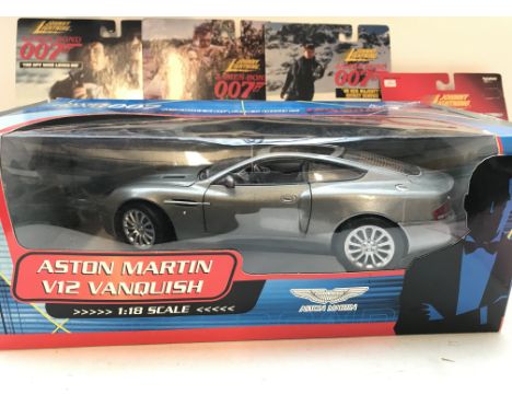 A Collection of Johnny lightning James Bond cars and 1:18 scale Aston Martin V12 Vanquish all boxed