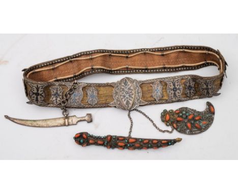 A 19th century Middle Eastern niello work belt:, the floral decorated buckle with additional panel decorated en suite on a si