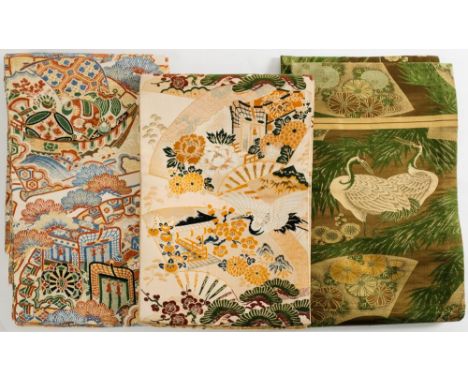 Three Japanese silk Obi (kimono sash):, one in the Kutani style, another with cranes over pagodas the third in green with cra