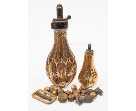 A 19th century copper powder flask: with embossed foliate decoration, a brass shot flask and a small quantity of Royal Artill