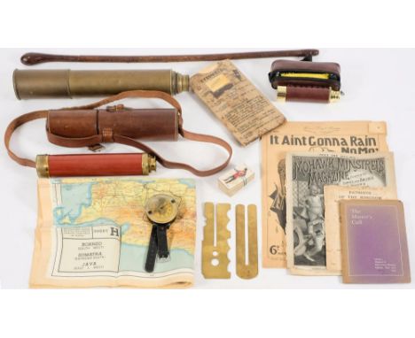 A collection of various militaria:, including a WWII wrist compass and MK3 eye shields, a leather swagger stick, a brass thre