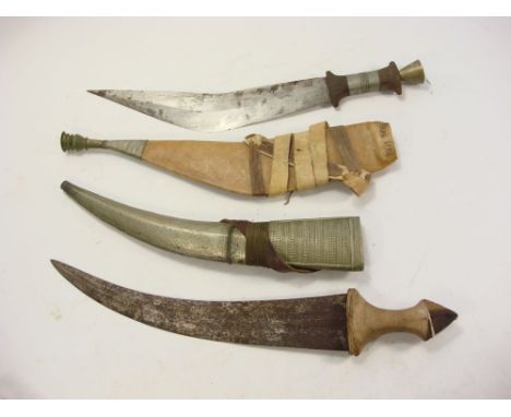 Two North African jambiya:, one in a leather scabbard the other in a plated scabbard (2)