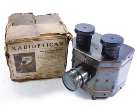 A tinplate Radioptican projector by H C White Company , Vermont USA:,  green with gilt banding in original box , 28cm high ( 