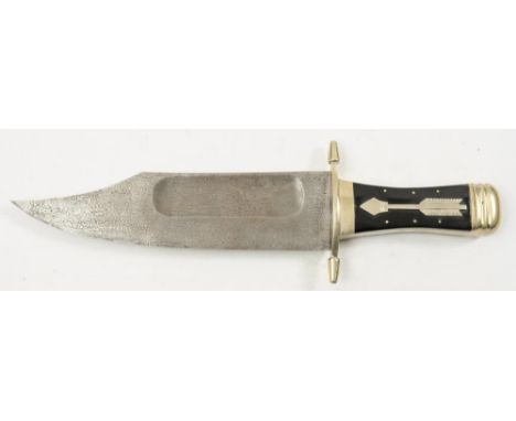 A large Bowie knife:, the clipped back damascus blade over a silver plated hilt with shaped quillons and two piece buffalo ho