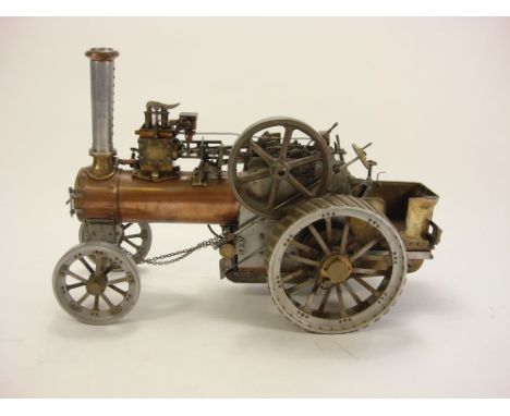 A live steam scale model traction engine:, with copper boiler, steel gears and 4 1/2 inch six spoke flywheel, with six inch s