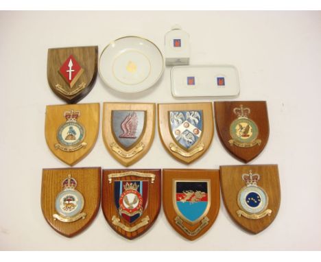 A collection of mess room badges on shield plinths:, together with a framed set of enamel RAF squadron badges (one missing) a