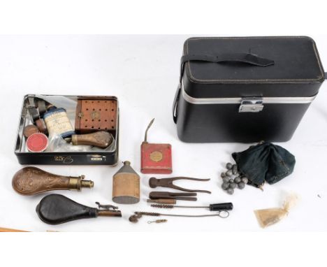 Two copper and brass powder flasks:,together with a leather shot flask, a riding crop, gun cleaning rods and other related ac