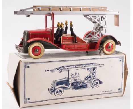 A tinplate clockwork fire engine:, with silver turntable and ladder, red lithograph printed cab, chassis, firemen and white t