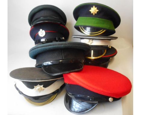 A collection of British Army peaked caps: includes Grenadier Guards, Coldstream Guards, Irish Guards, Royal Engineers, R.E.M.