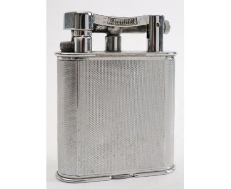 A Dunhill silver plated petrol table lighter:, signed as per title to arm, on an engine milled case, 10.5cm high.