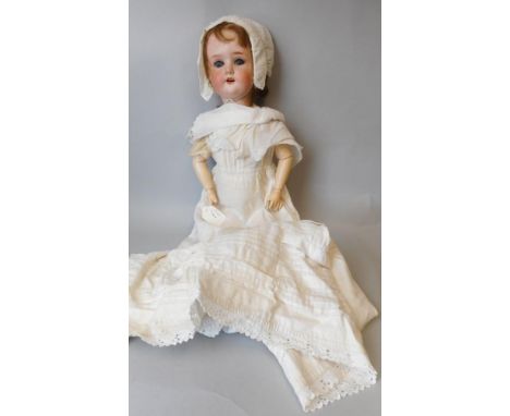 A Schoenau and Hoffmeister bisque head doll, impressed S.  PB within a star. H 1900.5. Germany,: with fair mohair wig, weight