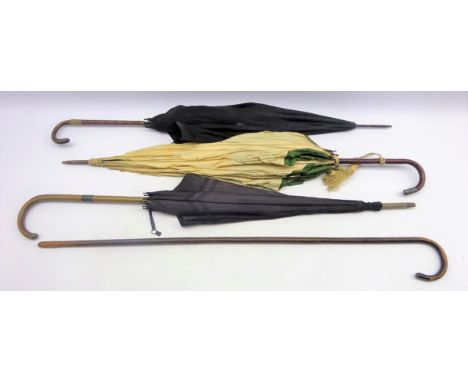 Ladies umbrella by Brigg and Son with silver collar, another with Partridge wood handle, parasol with crook handle and a walk