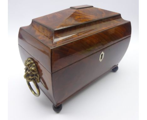 Regency figured mahogany sarcophagus top tea caddy, interior fitted with two box tea canisters with hinged lids and central g