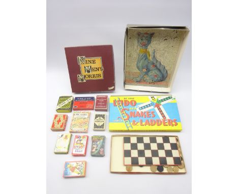 1920's wooden jigsaw depicting a Galle style cat, quantity of card games including Disney, Rupert Bear, Noddy etc and other g