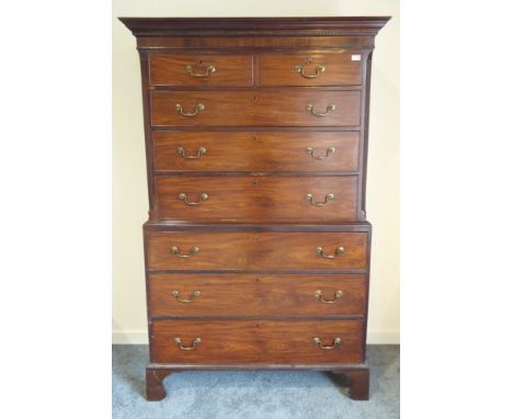 George III figured mahogany chest on chest, projecting dentil cornice above two short and six long graduating drawers, top se