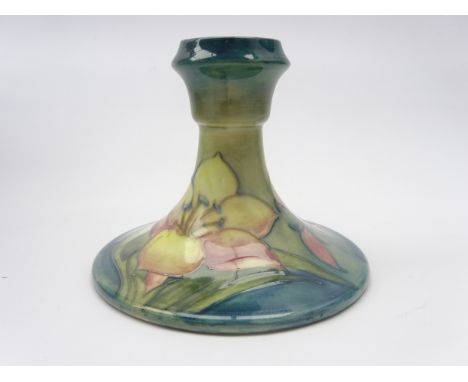 Moorcroft dwarf candlestick decorated in the Freesia pattern, with original Queen Mary label and impressed marks, H10cm  Cond