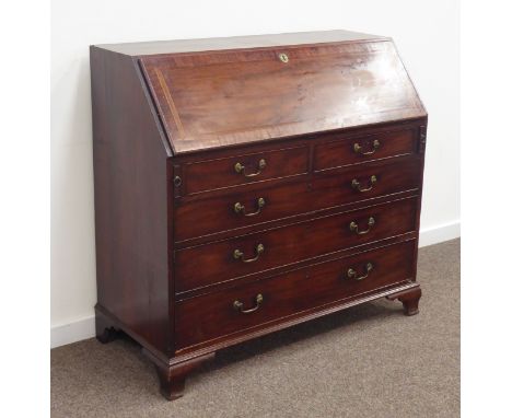 George III mahogany bureau, banded fall front enclosing a well fitted interior with drawers and cupboards, above two short an
