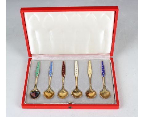 A set of six Danish sterling silver gilt and enamelled coffee spoons, each tapering handle enamelled in a different colour, d