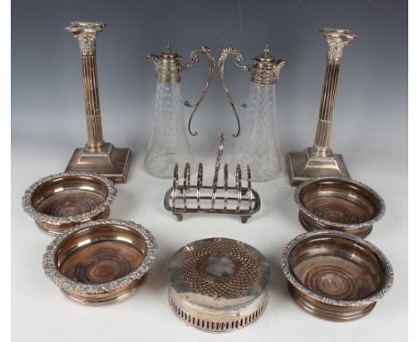 A group of plated items, including a pair of Corinthian column candlesticks, height 29cm, a pair of cut glass ewers, height 2