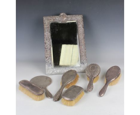 An Edwardian silver mounted rectangular dressing table mirror, Birmingham 1902 (lower portion of silver lacking), and a group