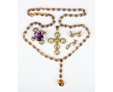 A Victorian amethyst single stone brooch, mounted with a large oval cut amethyst, width 4.4cm, a pair of citrine single stone