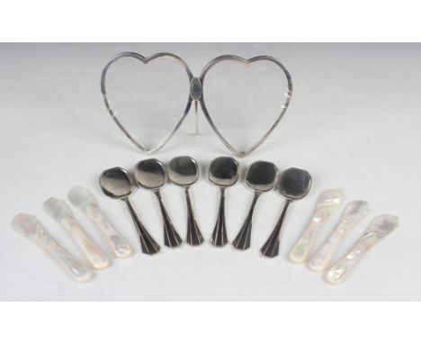 A late Victorian silver twin heart shaped photograph frame, London 1896 by Atkin Brothers, height 11cm, and a set of six Cont