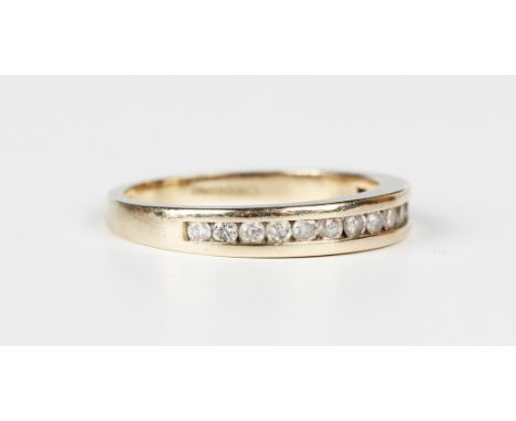 A 9ct gold and diamond half eternity ring, mounted with a row of circular cut diamonds, detailed '.25 DIA', London 1998, weig