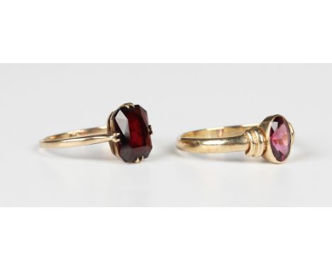 A gold ring, claw set with a cut cornered rectangular cut garnet, detailed '9ct', ring size approx P1/2, and a 9ct gold ring,