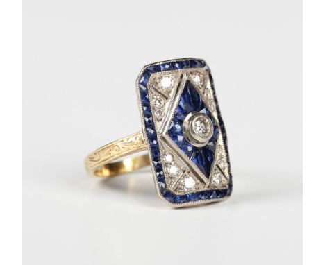 A gold, sapphire and diamond ring in an Art Deco inspired design, collet set with the principal circular cut diamond within a