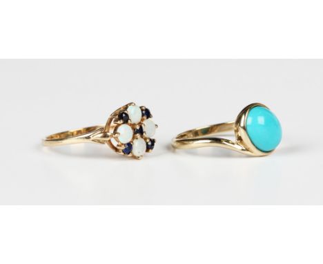 A 9ct gold, opal and sapphire cluster ring, Birmingham 1987, ring size approx P, and a 9ct gold ring, mounted with an oval tu