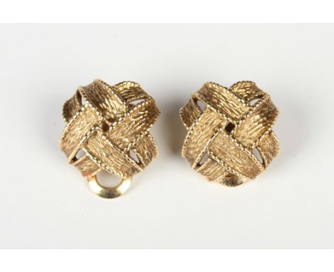 A pair of 9ct gold earclips, each of textured interwoven design, London 1971, weight 12.1g, length 2cm.Buyer’s Premium 29.4% 