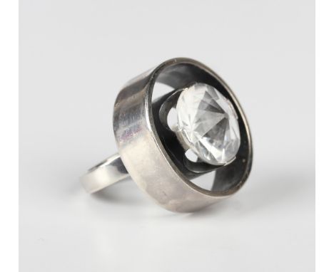 A Hans Hansen silver and rock crystal ring, circa 1960s, designed by Karl Gustav Hansen in an openwork circular design, mount