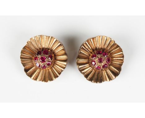 A pair of Garrard &amp; Co Ltd 9ct gold and ruby earclips, each designed as a stylized flowerhead, London 1954, weight 13.6g,