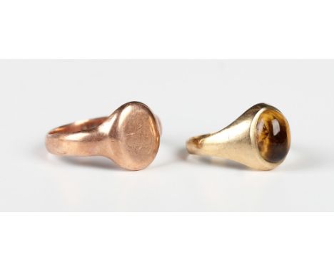 A 9ct rose gold signet ring, monogram engraved, Birmingham 1918, ring size approx T1/2, and a 9ct gold ring, mounted with an 